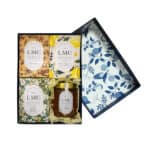 A Lize Mouton Collection branded gift box containing spicy chai, lemon, chamomile and lavender and Jasmine and Orange Blossom teas and a jar of citrus honey