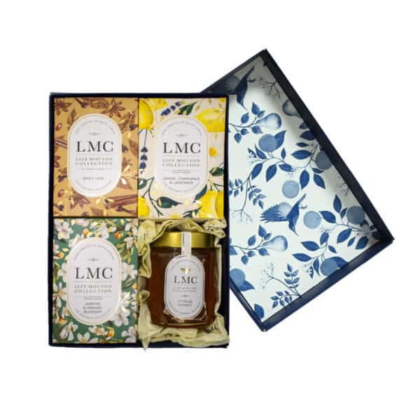 A Lize Mouton Collection branded gift box containing spicy chai, lemon, chamomile and lavender and Jasmine and Orange Blossom teas and a jar of citrus honey