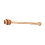 A wooden honey spoon branded with the Lize Mouton Collection logo