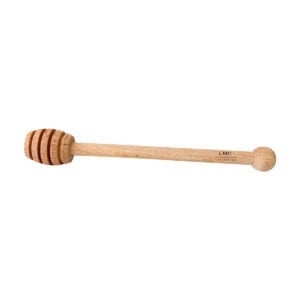 A wooden honey spoon branded with the Lize Mouton Collection logo